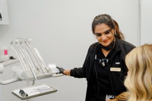 Dr. Sharma and a patient at The Dental Bar